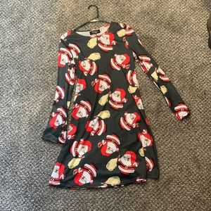 Green long sleeve dress with Santa print. SIZE SMALL.